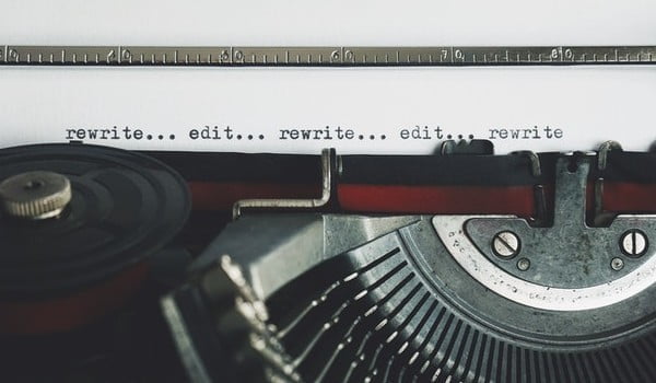 a close up of an old fashioned typewriter with script on a page